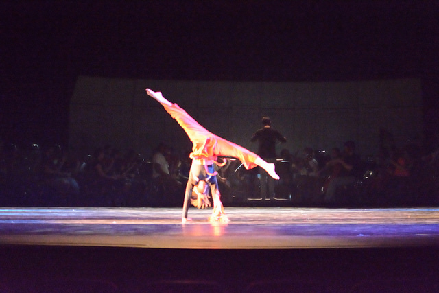 Dancer doing handstand during Firebird dance. 